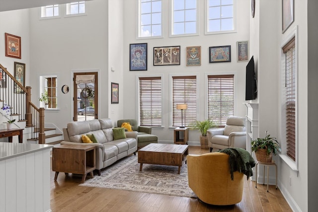 1588 Cobbler Ct, Chattanooga, TN 37421 - living room featuring a towering ceiling, hardwood / wood-style flooring, and stairway