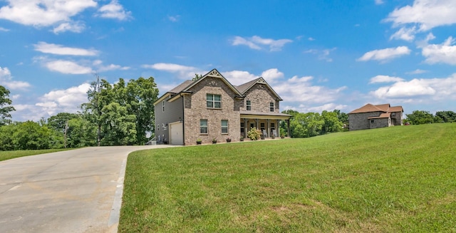 267 Alonzo Pl, Cunningham, TN 37052 - view of front of house featuring brick siding, an attached garage, driveway, and a front lawn