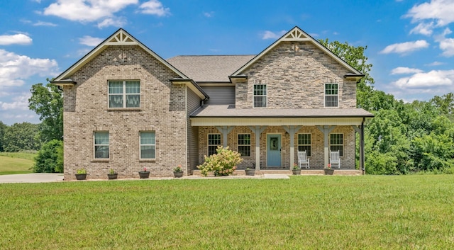 267 Alonzo Pl, Cunningham, TN 37052 - craftsman-style home featuring a porch, a front lawn, and brick siding