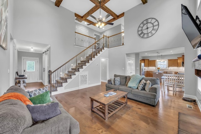 267 Alonzo Pl, Cunningham, TN 37052 - living area with a towering ceiling, stairway, wood-type flooring, beamed ceiling, and coffered ceiling
