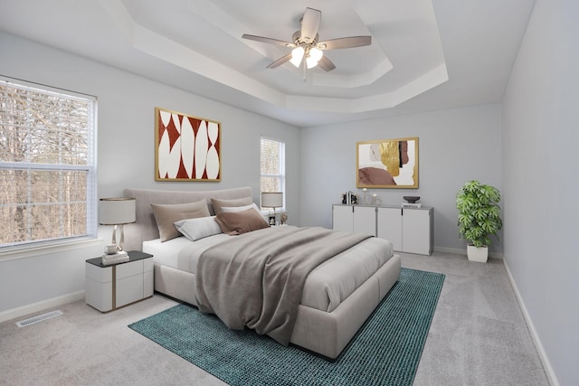 3044 Stone Bridge Rd, Antioch, TN 37013 - bedroom featuring light colored carpet, a tray ceiling, and ceiling fan