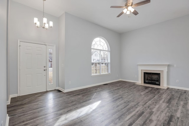 3044 Stone Bridge Rd, Antioch, TN 37013 - foyer entrance featuring a chandelier, dark wood finished floors, ceiling fan, and a high end fireplace