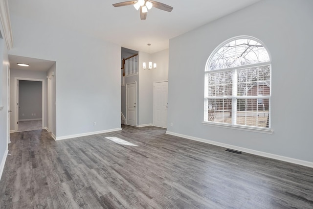 3044 Stone Bridge Rd, Antioch, TN 37013 - spare room featuring a ceiling fan, a chandelier, healthy amount of natural light, and dark wood-style flooring