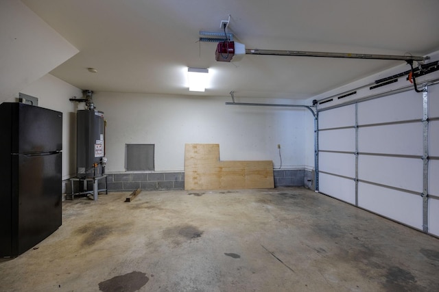 3044 Stone Bridge Rd, Antioch, TN 37013 - garage with freestanding refrigerator, gas water heater, and a garage door opener