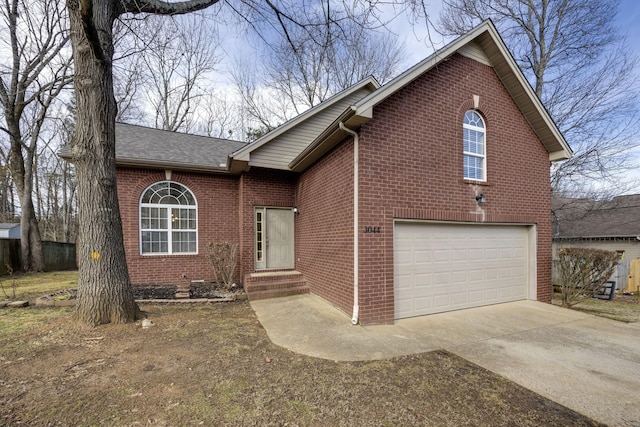 3044 Stone Bridge Rd, Antioch, TN 37013 - view of front of house with a garage, brick siding, driveway, and a shingled roof