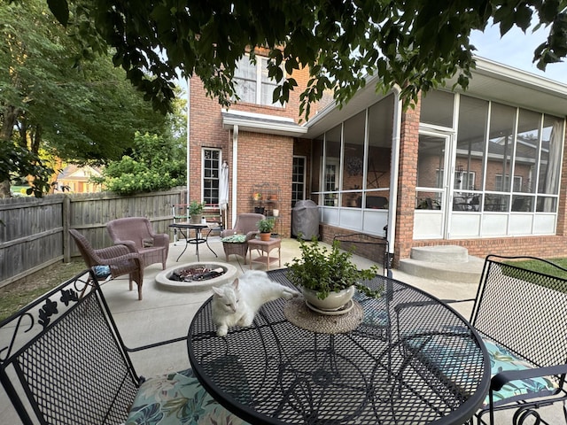 152 Yorkshire Dr, Clarksville, TN 37043 - view of patio featuring a fire pit, a sunroom, and area for grilling