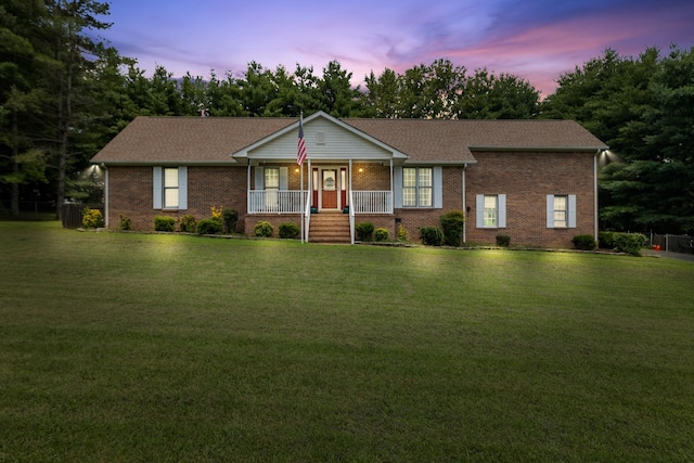 2007 New Castle Rd, Spring Hill, TN 37174 - single story home with a porch, brick siding, a yard, and a shingled roof