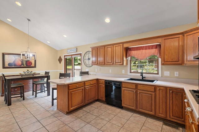 2007 New Castle Rd, Spring Hill, TN 37174 - kitchen featuring black dishwasher, a peninsula, light tile patterned floors, vaulted ceiling, and brown cabinetry