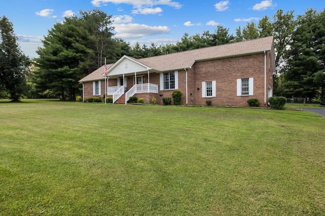 2007 New Castle Rd, Spring Hill, TN 37174 - ranch-style house featuring a porch, brick siding, and a front lawn