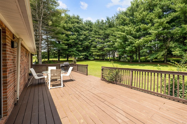 2007 New Castle Rd, Spring Hill, TN 37174 - deck featuring outdoor dining space, a lawn, and view of wooded area