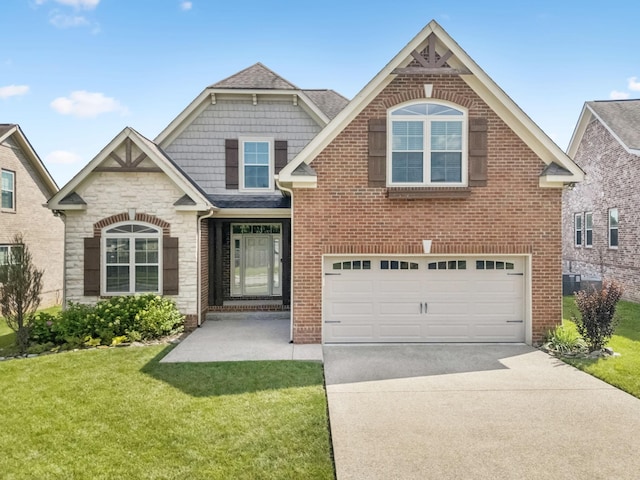 8005 Ragusa Cir, Spring Hill, TN 37174 - view of front of house with a garage, concrete driveway, a front lawn, stone siding, and brick siding