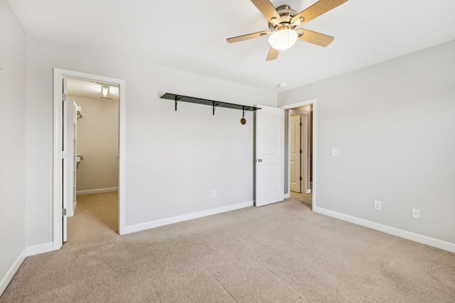 8005 Ragusa Cir, Spring Hill, TN 37174 - unfurnished bedroom with light colored carpet, a walk in closet, and a ceiling fan
