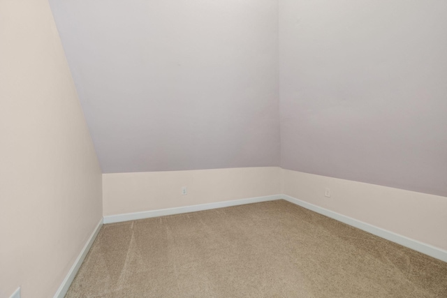 8005 Ragusa Cir, Spring Hill, TN 37174 - unfurnished room featuring light carpet and lofted ceiling