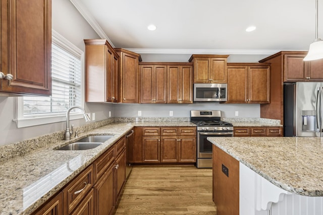 8005 Ragusa Cir, Spring Hill, TN 37174 - kitchen with appliances with stainless steel finishes, light wood-type flooring, ornamental molding, decorative light fixtures, and light stone countertops