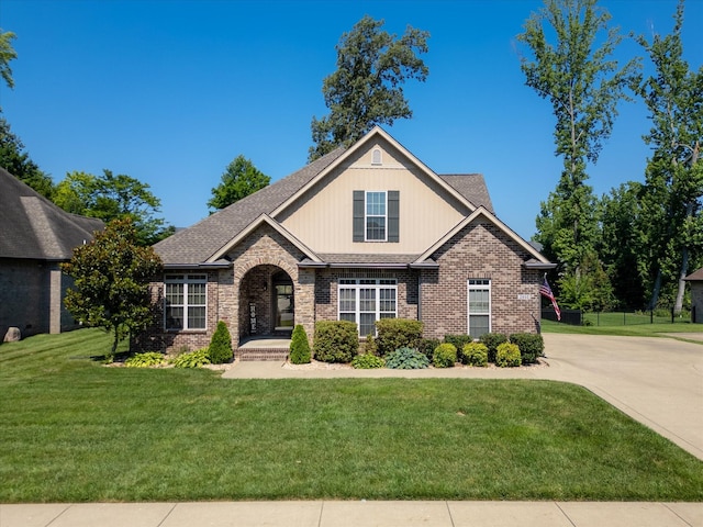 2950 Prince Dr, Clarksville, TN 37043 - view of front of property with brick siding, a front lawn, and a shingled roof