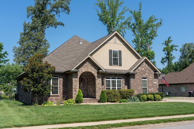 2950 Prince Dr, Clarksville, TN 37043 - craftsman-style house with brick siding, a front yard, and board and batten siding