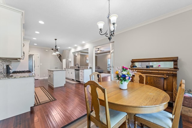 2950 Prince Dr, Clarksville, TN 37043 - dining space featuring ornamental molding, recessed lighting, a ceiling fan, dark wood finished floors, and a chandelier