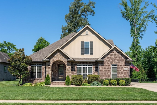 2950 Prince Dr, Clarksville, TN 37043 - view of front facade featuring brick siding, a front lawn, and roof with shingles