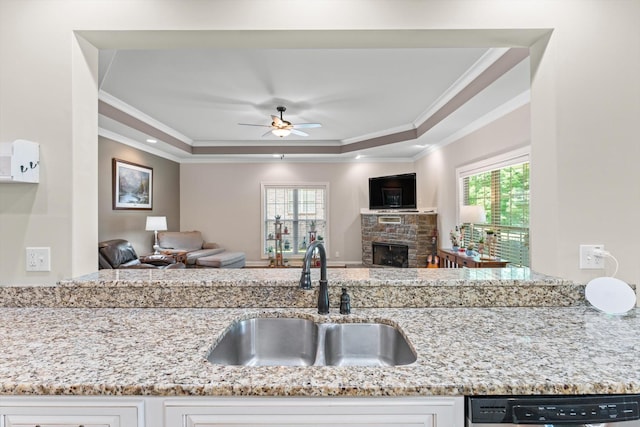 2950 Prince Dr, Clarksville, TN 37043 - kitchen featuring a raised ceiling, open floor plan, ornamental molding, and light stone countertops