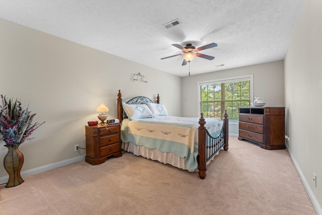 2950 Prince Dr, Clarksville, TN 37043 - bedroom with light carpet, a textured ceiling, and a ceiling fan