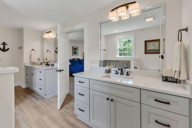 9003 Oden Ct, Brentwood, TN 37027 - ensuite bathroom featuring two vanities and a chandelier