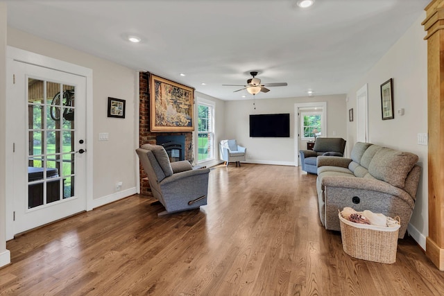 9003 Oden Ct, Brentwood, TN 37027 - living area with plenty of natural light, wood finished floors, a ceiling fan, a fireplace, and recessed lighting