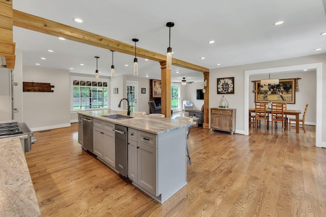 9003 Oden Ct, Brentwood, TN 37027 - kitchen featuring gray cabinets, stainless steel dishwasher, light wood finished floors, recessed lighting, and decorative light fixtures