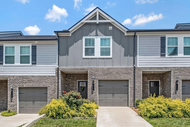 908 Oak Ridge Ln, Columbia, TN 38401 - townhome / multi-family property featuring a garage, brick siding, and board and batten siding