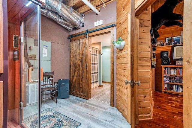 647 Omega Dr, Spring City, TN 37381 - interior space with wood finished floors and a barn door