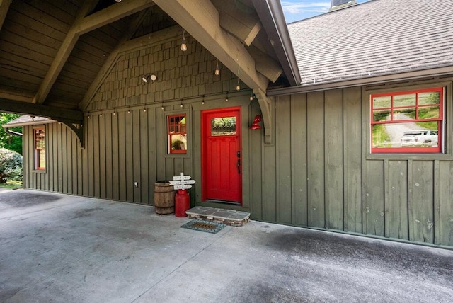 647 Omega Dr, Spring City, TN 37381 - entrance to property featuring board and batten siding, a shingled roof, a chimney, and a patio area