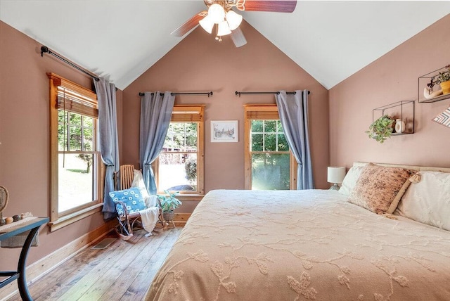 647 Omega Dr, Spring City, TN 37381 - bedroom with multiple windows, lofted ceiling, hardwood / wood-style floors, and ceiling fan
