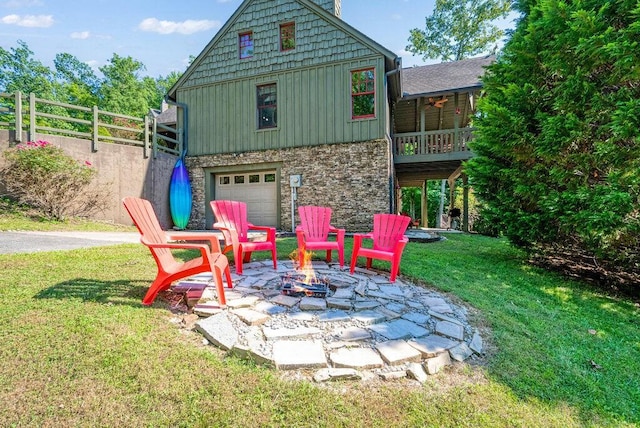 647 Omega Dr, Spring City, TN 37381 - view of patio / terrace with a fire pit and an attached garage