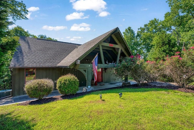 647 Omega Dr, Spring City, TN 37381 - view of front of house with a front lawn, a shingled roof, and board and batten siding