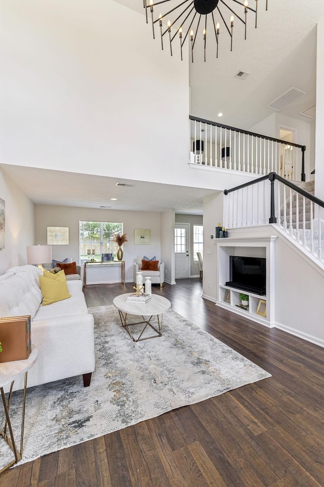 3037 Wilcot Way, Franklin, TN 37069 - living room with wood finished floors, a high ceiling, a chandelier, and stairs