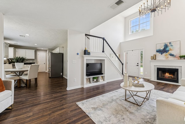 3037 Wilcot Way, Franklin, TN 37069 - living room with stairs, dark wood-type flooring, a fireplace, recessed lighting, and a towering ceiling