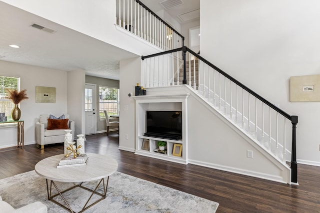 3037 Wilcot Way, Franklin, TN 37069 - living room featuring wood finished floors, stairs, and a towering ceiling