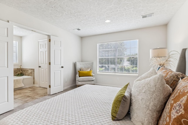 3037 Wilcot Way, Franklin, TN 37069 - bedroom featuring multiple windows, a textured ceiling, connected bathroom, and carpet