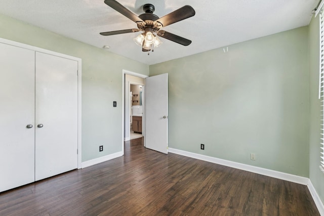 353 Greenleaf Ln, Clarksville, TN 37040 - unfurnished bedroom with dark wood finished floors, a closet, and a ceiling fan
