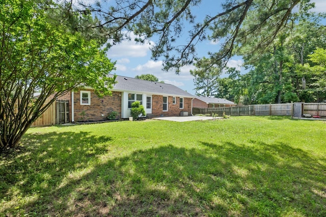 353 Greenleaf Ln, Clarksville, TN 37040 - rear view of property featuring brick siding, a patio, and a fenced backyard