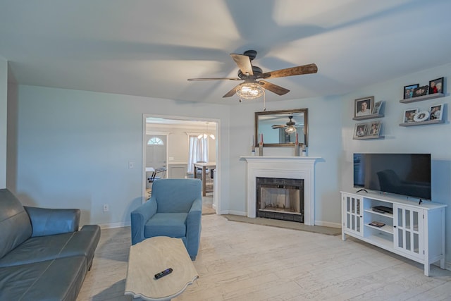 5334 Shelbyville Pike, Christiana, TN 37037 - living area with a ceiling fan, wood finished floors, and a fireplace