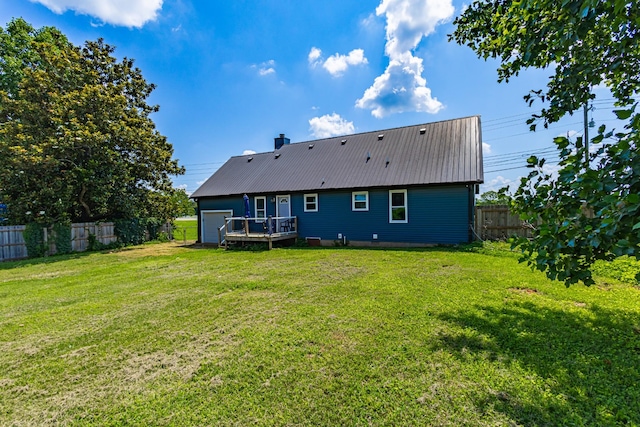 5334 Shelbyville Pike, Christiana, TN 37037 - back of property featuring a deck, a fenced backyard, a metal roof, an attached garage, and a chimney