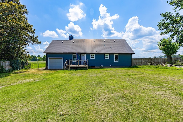 5334 Shelbyville Pike, Christiana, TN 37037 - back of property featuring a fenced backyard, a wooden deck, a garage, a metal roof, and driveway