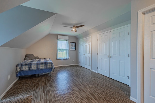 5334 Shelbyville Pike, Christiana, TN 37037 - bedroom with an AC wall unit, two closets, wood finished floors, vaulted ceiling, and a ceiling fan