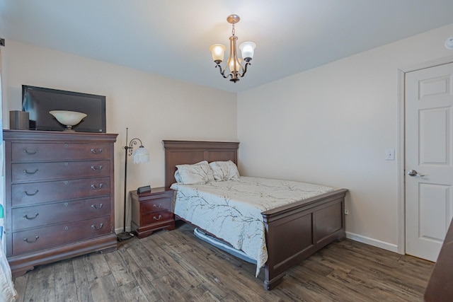 5334 Shelbyville Pike, Christiana, TN 37037 - bedroom featuring dark wood finished floors and a chandelier