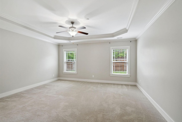 1000 Swanson Ln, Franklin, TN 37064 - unfurnished room featuring a tray ceiling, ornamental molding, light colored carpet, and a ceiling fan