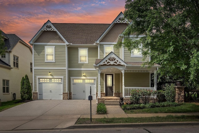 1000 Swanson Ln, Franklin, TN 37064 - victorian house with a porch, driveway, and an attached garage