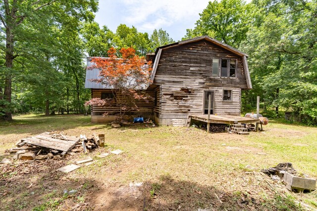 8116 Hixson Springs Rd, Signal Mountain, TN 37377 - back of house featuring a gambrel roof, log siding, a lawn, a metal roof, and a wooden deck