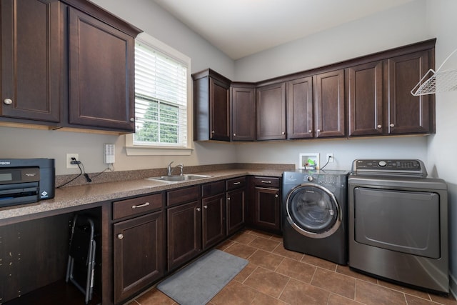 1825 Barnstaple Ln, Brentwood, TN 37027 - washroom with washer and dryer, dark tile patterned floors, and cabinet space