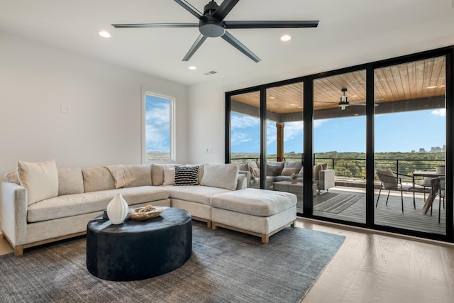 2118 Cliff Dr, Nashville, TN 37218 - living room with a ceiling fan, floor to ceiling windows, wood finished floors, and recessed lighting