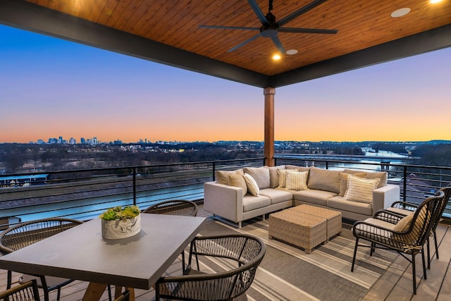 2118 Cliff Dr, Nashville, TN 37218 - patio terrace at dusk with a ceiling fan, a water view, an outdoor hangout area, and a balcony